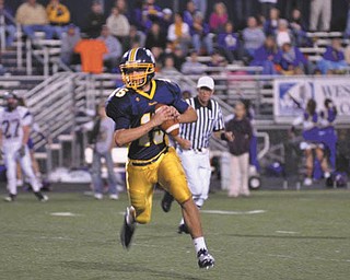 Josh Tekac, quarterback for Wilmington Area Greyhounds, is shown as he rolls out to pass during a recent home game.