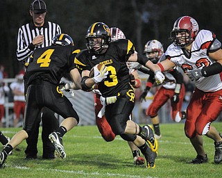 Crestview's Adam Coppock splits the Columbian defence on his way to Crestview's 1st TD during their game at Crestview on Friday night. Photo/Mark Stahl
