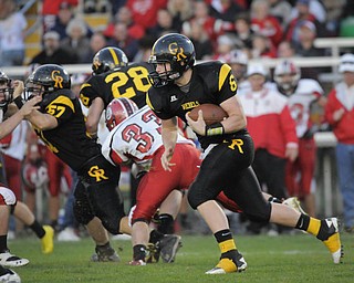 Crestview QB Carter Hill (6) tucks the ball in for a run against Columbiana during their game at Crestview on Friday night. Photo/Mark Stahl