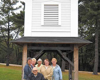 Members of the Harding Park Meeting House Building Committee stand in front of the bell tower salvaged from the historic First Presbyterian Church. They are,Joe Jendrasiak, front, and back from left, Mary Buchenic, Sue Lambert, Judy Ruby, Linda Clark and JoAnn Cutter. The committee plans to reassemble the church that was dismantled in the 1990s and make it a multipurpose center in Harding Park in Hubbard.