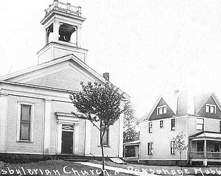 This photo shows the historic First Presbyterian Church and its parsonage that occupied the southeast corner of West Liberty and Hager streets in Hubbard. The church, built in 1857, was renovated in 1891 and 1923. It was dismantled in the 1990s and will be reassembled in Harding Park. In 1959, the church rebuilt on Westview Avenue in Hubbard.