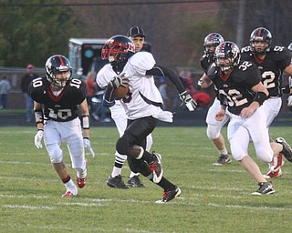 FOOTBALL - Ja'les Hughes is off to the end zone as he out runs (10) Zach Penick and (32) Charles Shrontz Friday night in Salem. - Special to The Vindicator/Nick Mays