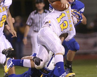 ROBERT K. YOSAY | THE VINDICATOR..Indians #12 Josh Melhourn is upended by Blue Devil #31 Tommy Marlowe - during second quarter action at Western Reserve Blue Devils vs Southern Local Indians at Western Reserve Stadium ..-30-..