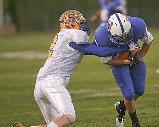 ROBERT K. YOSAY | THE VINDICATOR.. Indians #2 Trey Griffith attempts to bring down #5 John Rosati of Blue Devils after a first down pass in the first half - Western Reserve Blue Devils vs Southern Local Indians at Western Reserve Stadium ..-30-..