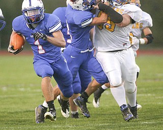 ROBERT K. YOSAY | THE VINDICATOR..Blue Devils #1 Ryley Sheptock takes off for pay dirt for a 50+ yard touch down run in the first quarter - behind him is #2 Donnie Bolton giving the INdians #65 Levi Haddox a key block for the TD RUN - Western Reserve Blue Devils vs Southern Local Indians at Western Reserve Stadium ..-30-..
