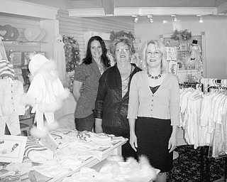 Prepared to select clothing to be featured at the YBPW Champagne Luncheon and Fashion Show on Oct. 9 at Antone’s Banquet Center in Boardman are, from left, Melissa Lias, president of YBPW; Anne McMahon, former club president; and Sandra Barger, fashion show chairwoman.