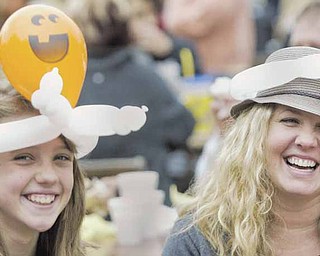 Charlotte Voytko, 11, and her mother, Kara Voytko, sport balloon hats made by a clown at the 34th annual Boardman Oktoberfest on Sunday in Boardman Township Park. They said attending the annual festival sponsored by Boardman Rotary is a family tradition.