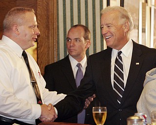 William d Lewis The Vindicator VP Joe Biden shakes hands with John Naples, one of the owners of the Golden Dawn during a visit Monday by the VP to Youngstown.