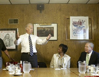 William D. Lewis | The Vindicator ||
Vice President Joe Biden, standing, talks during lunch at the Golden Dawn with, from left, Alice Lev, John Kopp, Cynthia McWilson, Ohio Gov. Ted Strickland, and two unidentified area residents.