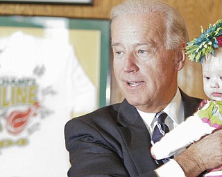 William D Lewis|The Vindicator VP Joe Biden holds 6 month old Amelia Nagy during a visit to the Golden Dwan in Youngstown Monday. She is the daughter of Jon and Caroline Nagy of Liberty.