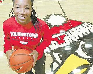 Youngstown State basketball player Macey Nortey stands at center court of the Beeghly center during media day. Nortey, a junior guard, is one of four returning starters for the Penguins, who began practice for the first time under new head coach Bob Boldon on Monday — about two weeks earlier than the NCAA has allowed in previous years.
