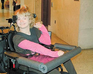 Haley Cobb, 10, of Leavittsburg, takes a break outside of the courtroom of Judge W. Wyatt McKay in Trumbull County Common Pleas Court. Her parents sued the doctor who delivered her in January 2000 for medical malpractice, saying the doctor’s failure to suggest Haley be delivered by Caesarean section caused the child’s cerebral palsy.