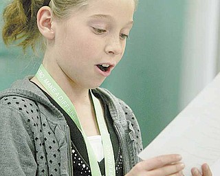 Kayla Sahli reads a part during her audition. She is one of more than 90 Frank Ohl fifth-graders participating in the new drama club this year.