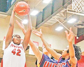 YSU Penguins Brandi Brown (42) grabs another rebound against UIC Flames Lauren Gatto (30) and Jasmine Bailey (25) at Beeghly Center, Saturday February 6, 2010.