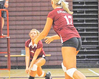 Boardman's Casie Saunders, left, Keyleigh Lipke (17) Amanda Volsin (14) cover the ball against Hoover during their game at Boardman on Tuesday night.