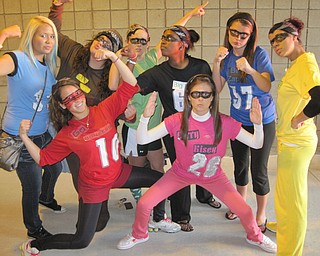 Ursuline irish girls cheer on the senior boys dressed as superheroes