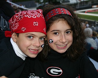Young Girard fans, Francesca and Dante Byrne show their Indian spirit at the game against Hubbard.