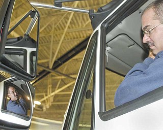 Larry Poage, Ohio Department of Transportation employee, checks the mirrors of his snow plow during an annual preseason inspection Wednesday at ODOT’s Canfield garage. ODOT District 4 is second in the state for average snowfall with 81 inches. ODOT District 12, which includes Cuyahoga and Geauga counties, is first with 88.4 inches of snow on average.