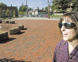 Martha Morgan, project manager at Wick Neighbors Inc., looks over Harrison Common, the first project in an overall plan to revitalize Youngstown’s Smoky Hollow neighborhood.