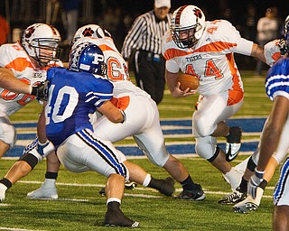Geoffrey Hauschild|The Vindicator.Howland's Brandon Neilan (44) runs downfield during the second quarter of a game at Poland High School on Friday evening.