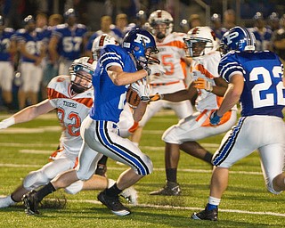 Geoffrey Hauschild|The Vindicator.Poland's Anthony Machi (2) makes his way past Howland's Dan Russell (32) during the second quarter of a game at Poland High School on Friday evening.
