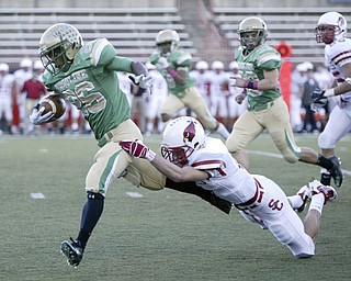 William D Lewis The Vindicator Usulines Akise Teague eludes St Charles #6 during first qtr action Friday.