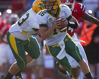 Geoffrey hauschild|The Vindicator.North Dakota's Brock Jensen (16) runs downfield during the first quarter of a game at Youngstown State University's Stambaugh Stadium on Saturday evening.
