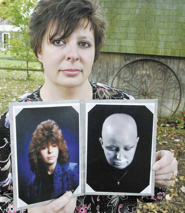 Breast-cancer survivor Heather Kish of Warren holds two photos of herself. The photo at left is from her senior year of high school, and the one at right was taken during her six months of chemotherapy treatment. 