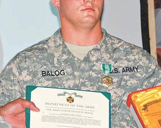 Balog receives his award for first place in the United States Division-South Noncommissioned Officer of the Quarter competition..
