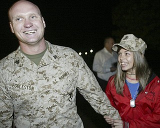 William D. Lewis|The Vindicator Marine Reserve Sgt. Robert Eggleston is greeted by his neiece Wendy Ford of Struthers upon arriving at the Youngstown Airbase from Afghanistan Thursday night.