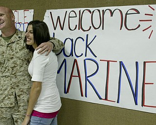 William D. Lewis|The Vindicator Marine Reserve Sgt. Robert Eggleston is greeted by his girlfriendPatty Ryser upon arriving at the Youngstown Airbase from Afghanistan Thursday night.