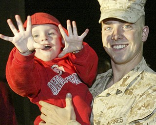 William D. Lewis|The Vindicator Marine Reservist Seth Tipton of Cambridge, OH is greeted by his nephew Conner Tipton upon arriving at the Youngstown Airbase from Afghanistan Thursday night.