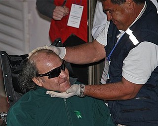 A paramedic embraces rescued miner Franklin Lobos, left, 53, as he arrives to the hospital of Copiapo, Chile, Wednesday, Oct. 13, 2010. Lobos is the twenty-seventh of 33 miners rescued from the San Jose mine after more than 2 months trapped underground. (AP Photo/Dario Lopez-Mills)