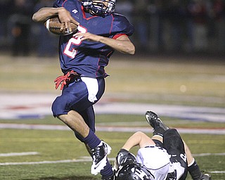 ROBERT K. YOSAY | THE VINDICATOR..Going for  1st and then and then  some as #2 Demitious Davis dances by Perrys #24  Tony Magnacca  .....Austintown Fitch hosted Massilon Perry Panthers  at Fitch Stadium...  --30-..