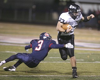 ROBERT K. YOSAY | THE VINDICATOR..Fitchs #3 Cameron Patterson reaches back to grab Perry's #33 ----------Austintown Fitch hosted Massilon Perry Panthers at Fitch Stadium... --30-..