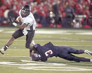 ROBERT K. YOSAY | THE VINDICATOR..#3 Demitrious Davis - takes down #7 by a shoe string - Austintown Fitch hosted Massilon Perry Panthers at Fitch Stadium... --30-..