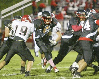 William D. Lewis|The Vindicator Campbell's Ja Les Hughes finds a hole during 1 rst half action Friday at Campbell.