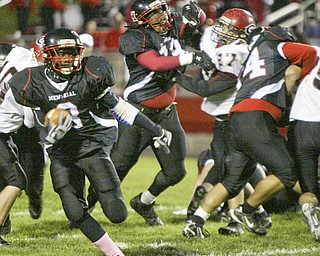 William D. Lewis|The Vindicator Campbell's Ja Les Hughes finds a hole during 1 rst half action Friday at Campbell.