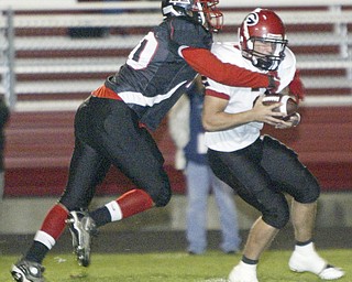 William D. Lewis|The Vindicator Campbell's#40- not on roster sacks Girard QB #2 not on roster during1 rst half action Friday at Campbell.