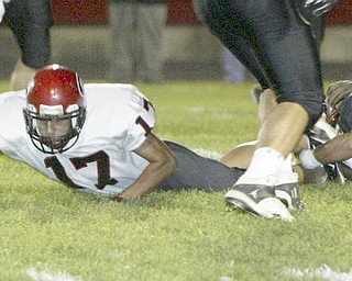 William D. Lewis|The Vindicator Girard's #17 extends for a first down during 1 rst half action Friday at Campbell.
