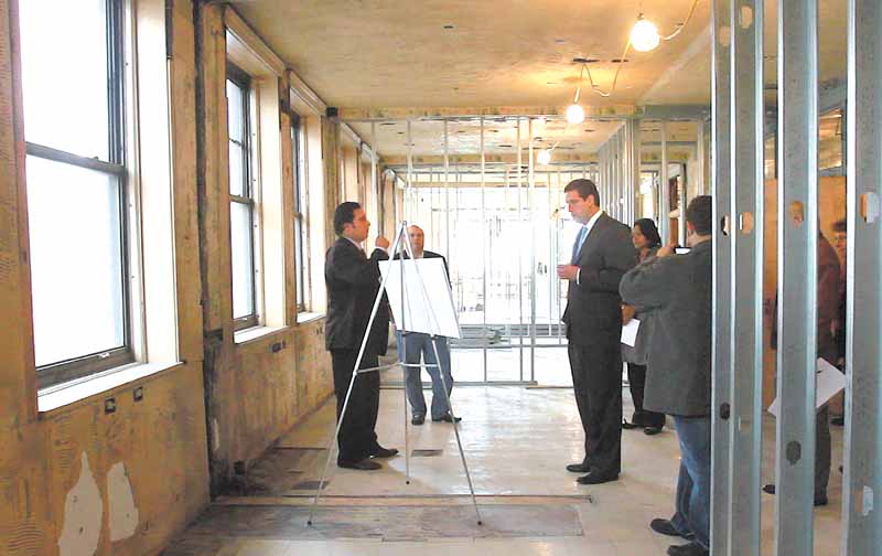 Dominic Gatta III, left, shows U.S. Rep. Tim Ryan of Niles D-17th, plans for apartments on the second floor of the Federal Building. The Gatta Co. of Niles is in the process of renovating the Youngstown landmark..