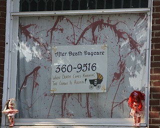 ROBERT K. YOSAY | THE VINDICATOR..After Death Day Care halloween display -  606 Niles Road, Niles--Spray painted baby dolls hanging from trees, cribs etc. very gory and offensive, a resident says.  City hall cannot do anything about it.  Homeowner spoke to Cohen on Monday.....  --30-..