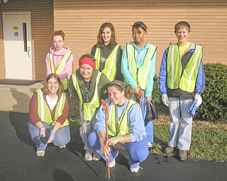
Members of the Rotary Club of Austintown and of the Fitch Interact Club spent a recent Saturday morning cleaning up the Kirk Road area, from state Route 46 to Whispering Pines Drive. Among those participating in the 10-year-long project were, from left, front row, Rebecca Leonard, Sammi Devenport and Christine Holmes, and in back, Courtney Francis, Summer Tarr,  Brianna Traylor and David Dalvin. In cooperation with the Green Team the cleanup crew not only picked up the debris, but also separated the recyclable items from the trash. As a result they accumulated three bags of recyclables and ten bags of trash.