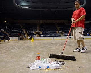 Geoffrey Hauschild|The Vindicator.6.26.2010.OVTC resident Jesse Repko works with a work crew from OVTC to clean up the Covelli Centre after a wrestling event.