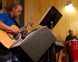 Geoffrey Hauschild|The Vindcator.8.4.2010.OVTC Intern Greg Todd and resident Steve Petracci perform during the group's weekly Wednesday night church service at Youngstown Christian Assembly. The men have chapel service every morning, and typically attend a church service every Wednesday evening and Sunday morning.