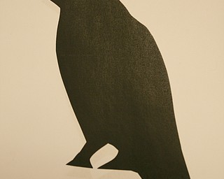 ROBERT K. YOSAY | THE VINDICATOR..A silhouette of a Raven used as Ninth graders at Jackson Milton High School taught fourth graders an interactive poetry lesson during a reading of The Raven by Edgar Allan Poe.... --30-..