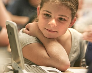 ROBERT K. YOSAY | THE VINDICATOR..Using a NIMO interactive pad - Bailee Thorn watches the screen as Ninth graders at Jackson Milton High School taught fourth graders an interactive poetry lesson during a reading of The Raven by Edgar Allan Poe.... --30-..