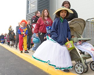 Geoffrey Hauschild|The Vindicator .Selina Castillo, 6, dresses as a southern belle in line to trick or treat at Covelli Centre on Saturday afternoon.