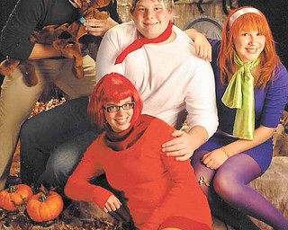 From top left, clockwise, Kyle Forward, Kevin Koncsol, Katelyn Lawrence and Maria Thompson dressed up as characters from the cartoon 'Scooby-Doo' for a costume contest Saturday at the Phantoms hockey game.