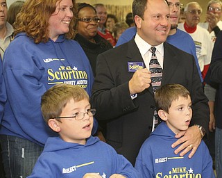 ROBERT K. YOSAY | THE VINDICATOR --..Mike gives the fist as he celebrates with his family Wife Karen and Mike 9 and Vincent 8 as results rolled in The November election had many incumbents and levies pass.... -30-..(AP Photo/The Vindicator, Robert K. Yosay)